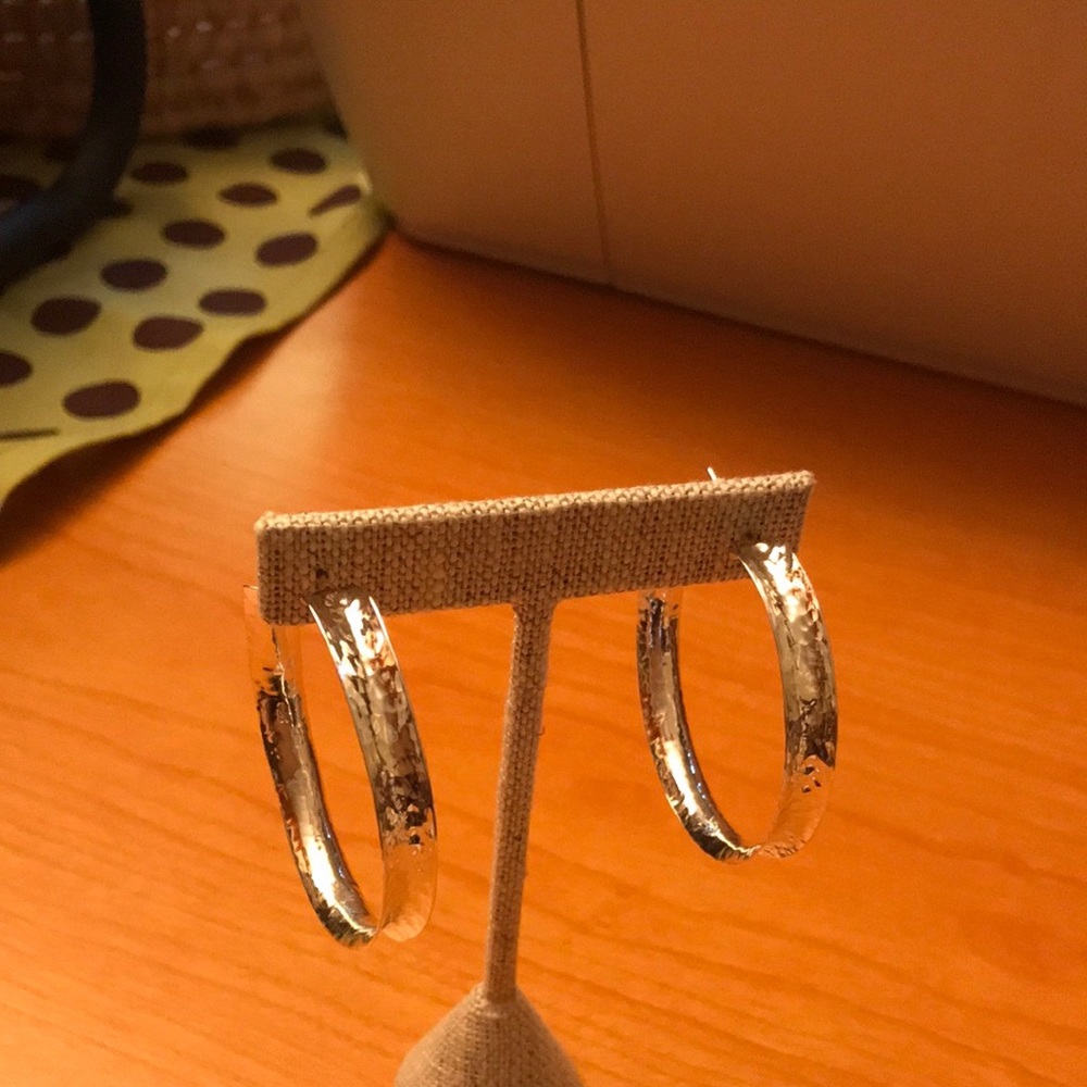 Sterling Silver hoop earrings.